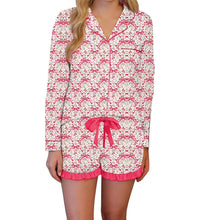 Load image into Gallery viewer, Woman wearing a pajama set with pink bows on a white background
