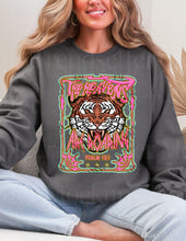Load image into Gallery viewer, Person wearing a dark gray sweatshirt with a colorful tiger graphic and text.
