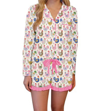 Load image into Gallery viewer, Woman wearing a pajama set with chicken pattern on a white background
